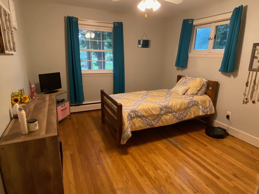 16 Worcester Road Townsend, MA 01469 - Photo 12 of 31 a spacious bedroom with a bed and wooden floor