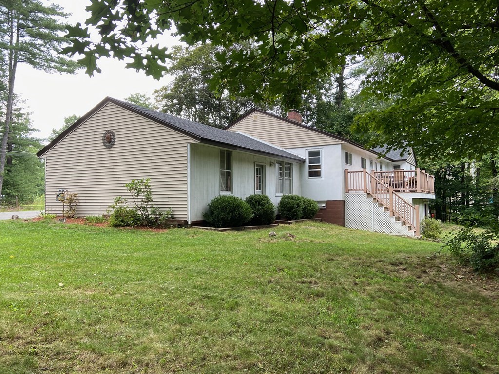 16 Worcester Road Townsend, MA 01469 - Photo 2 of 31 a house that has a tree in front of it