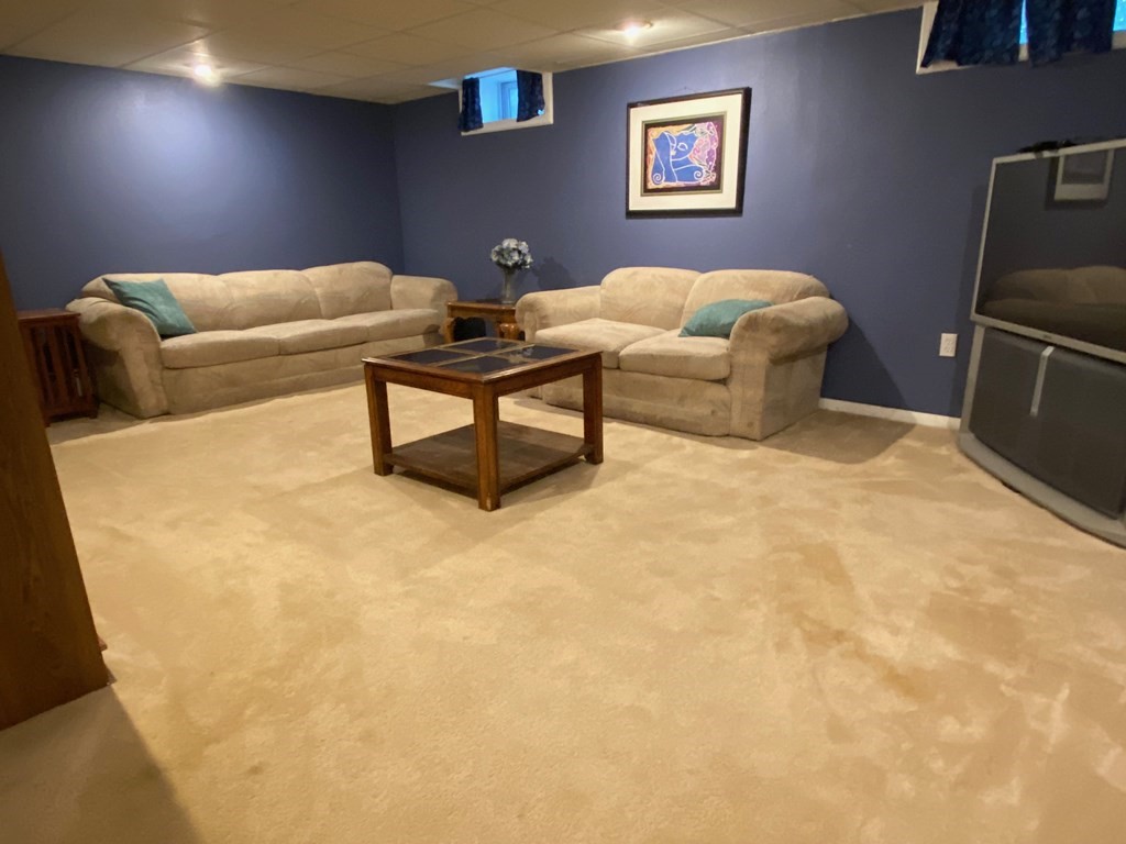 16 Worcester Road Townsend, MA 01469 - Photo 24 of 31 a living room with furniture and a bed