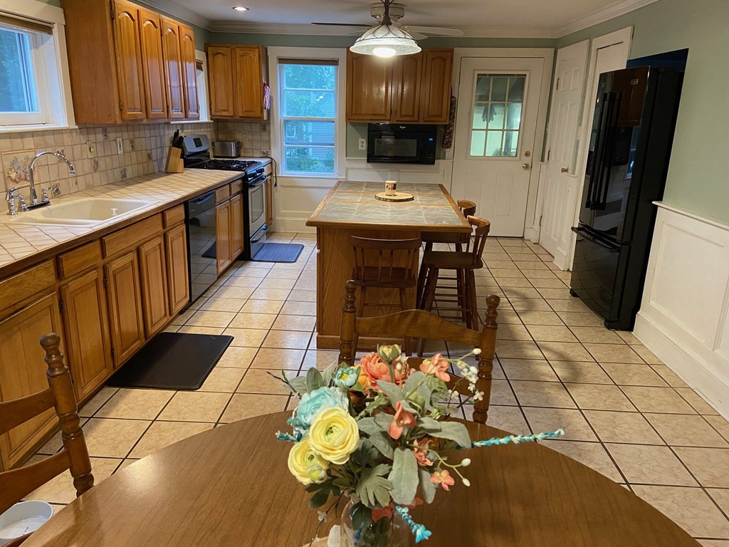 16 Worcester Road Townsend, MA 01469 - Photo 3 of 31 a kitchen with stainless steel appliances a sink stove and cabinets