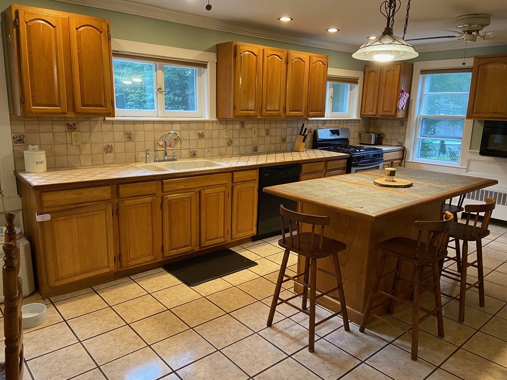 16 Worcester Road Townsend, MA 01469 - Photo 4 of 31 a kitchen with a sink cabinets and window