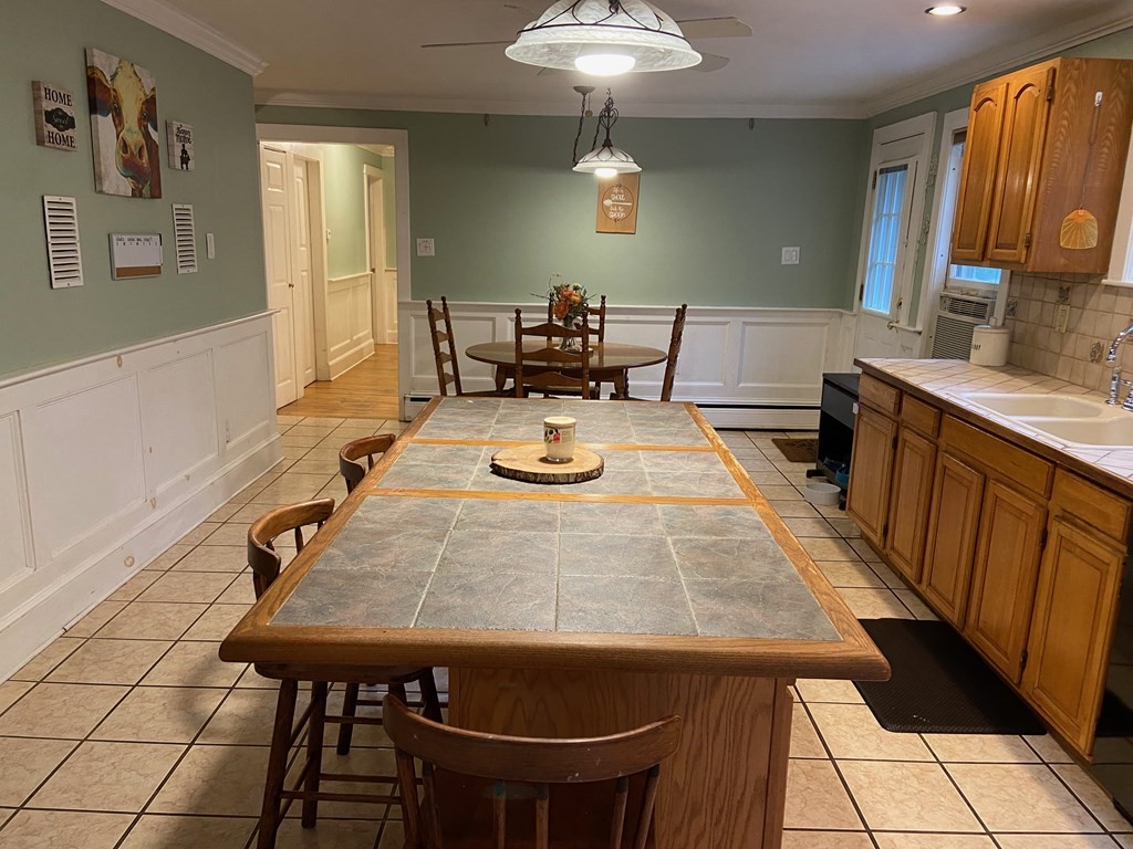 16 Worcester Road Townsend, MA 01469 - Photo 6 of 31 a dining room with a table and chairs