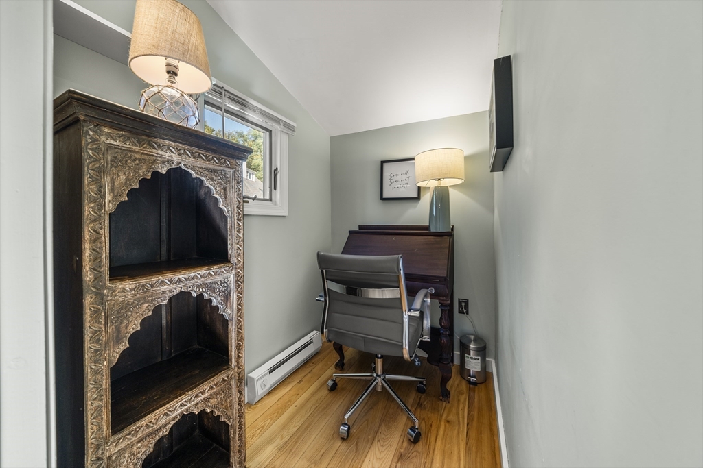 9 Gingerbread Hill, Unit 1 Marblehead, MA 01945 - Photo 11 of 16 a view of a hallway with workspace and a mirror