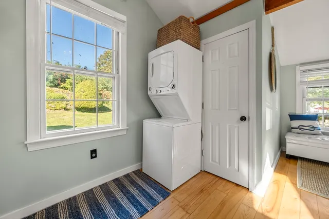 a view of an entryway with wooden floor and a bedroom