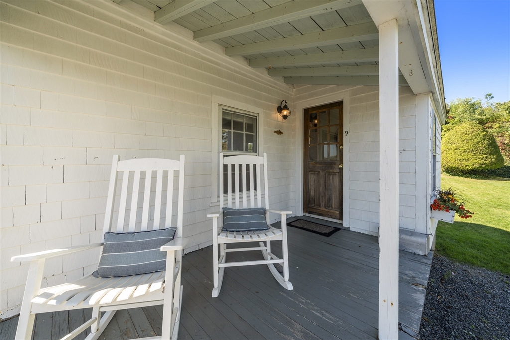 9 Gingerbread Hill, Unit 1 Marblehead, MA 01945 - Photo 4 of 16 a view of front door with chair and wooden floor