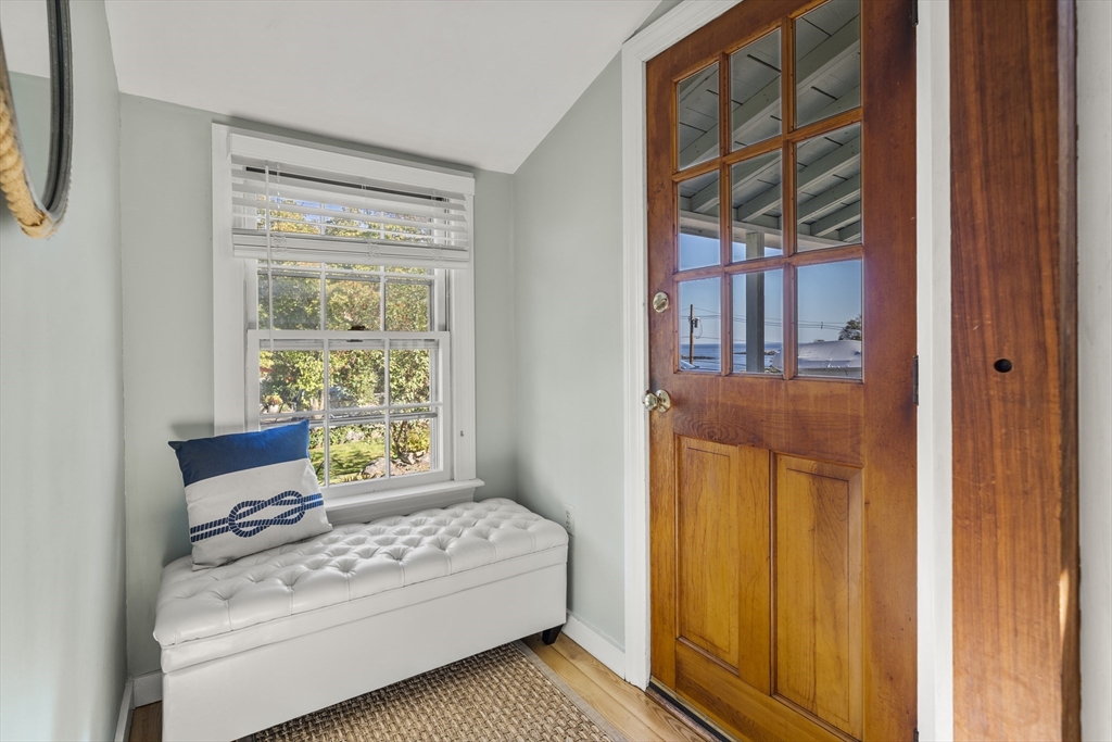 9 Gingerbread Hill, Unit 1 Marblehead, MA 01945 - Photo 5 of 16 a bedroom with a bed and a window