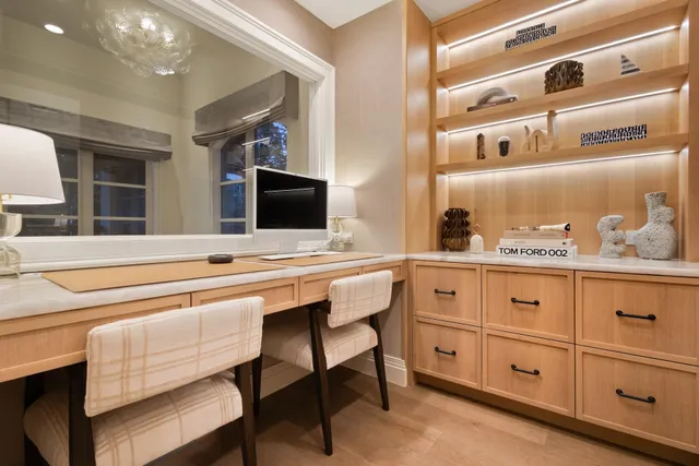 a room with a chair and a flat screen tv