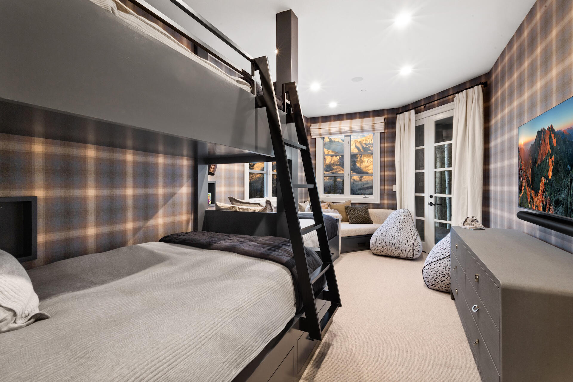 111 San Joaquin Road, Unit 19 Mountain Village, CO 81435 - Photo 18 of 22 a bedroom with a bed couch and a large window