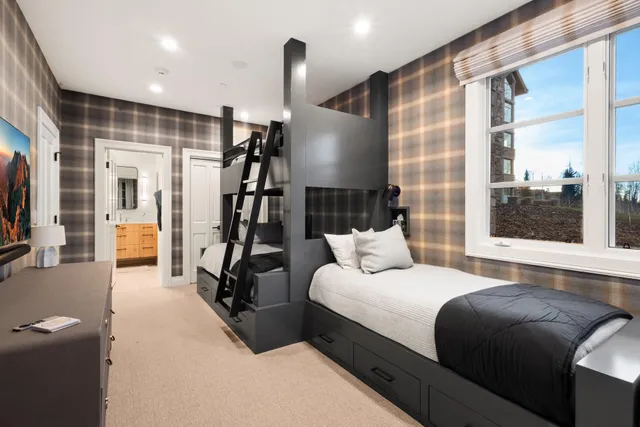 a bedroom with a bed window and a couch