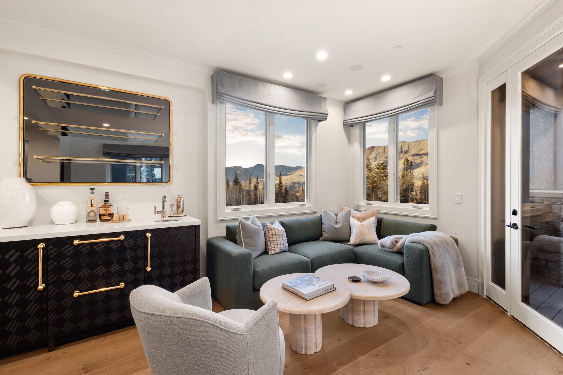 111 San Joaquin Road, Unit 19 Mountain Village, CO 81435 - Photo 3 of 22 a living room with furniture and a large window