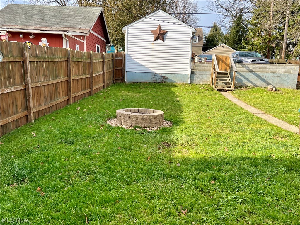 157 North 2nd Street Rittman, OH 44270 - Photo 8 of 43 View of back yard with a fire pit
