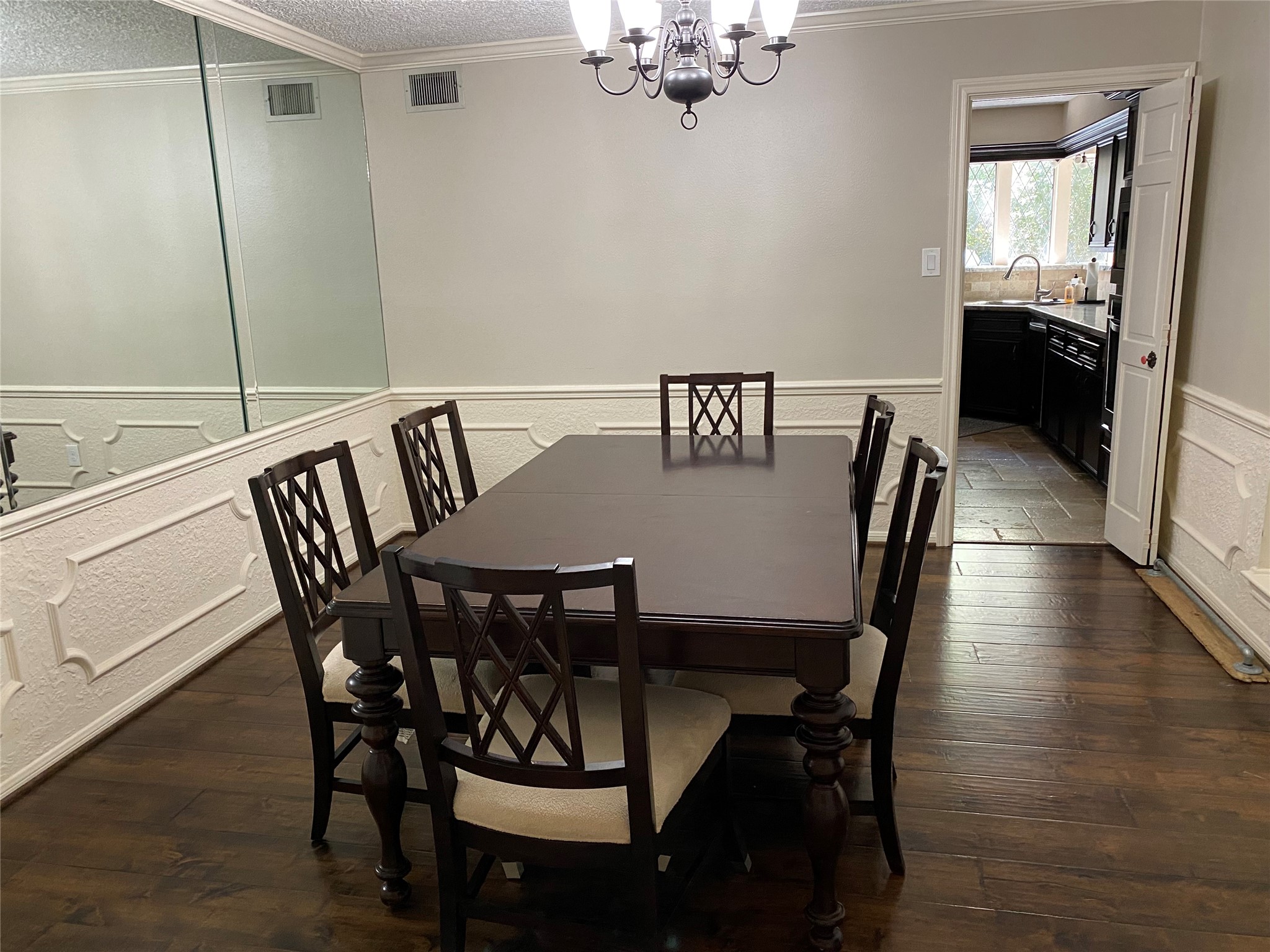 28 Tangle Brush Drive Spring, TX 77381 - Photo 11 of 29 a view of a dining room with furniture wooden floor and chandelier