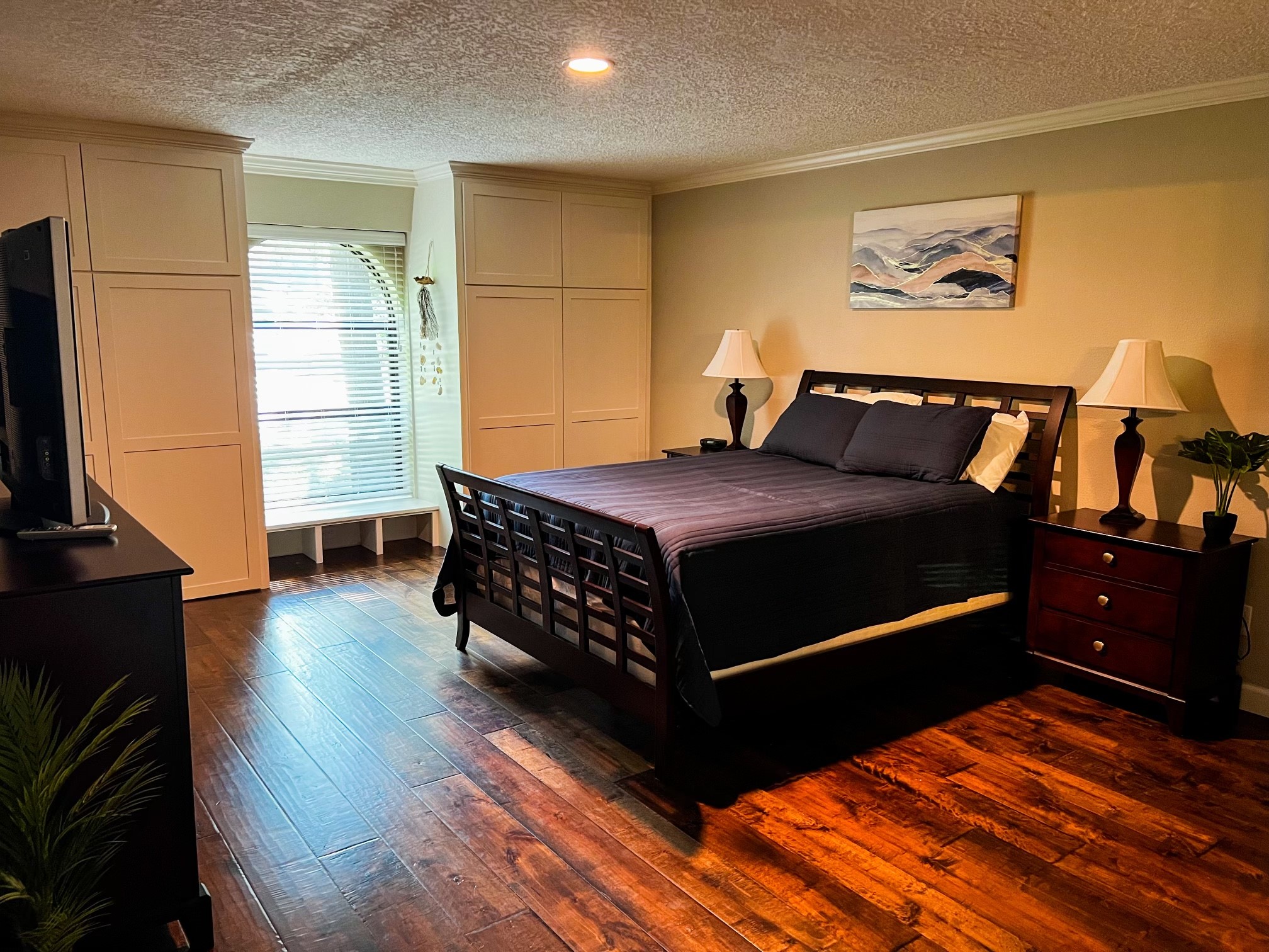 28 Tangle Brush Drive Spring, TX 77381 - Photo 18 of 29 a bedroom with a bed and a flat screen tv