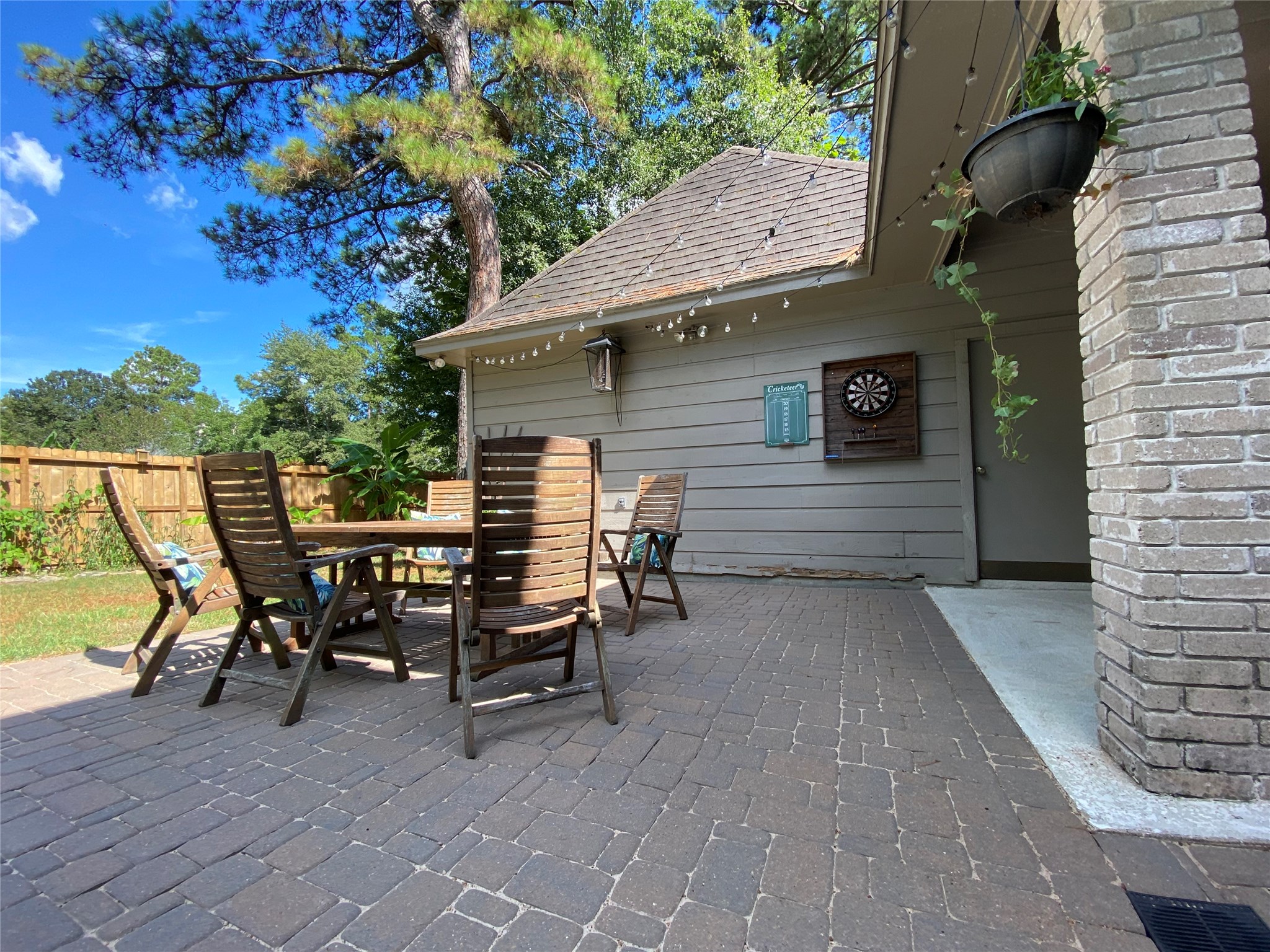 28 Tangle Brush Drive Spring, TX 77381 - Photo 7 of 29 a view of a patio with table and chairs with wooden floor and fence