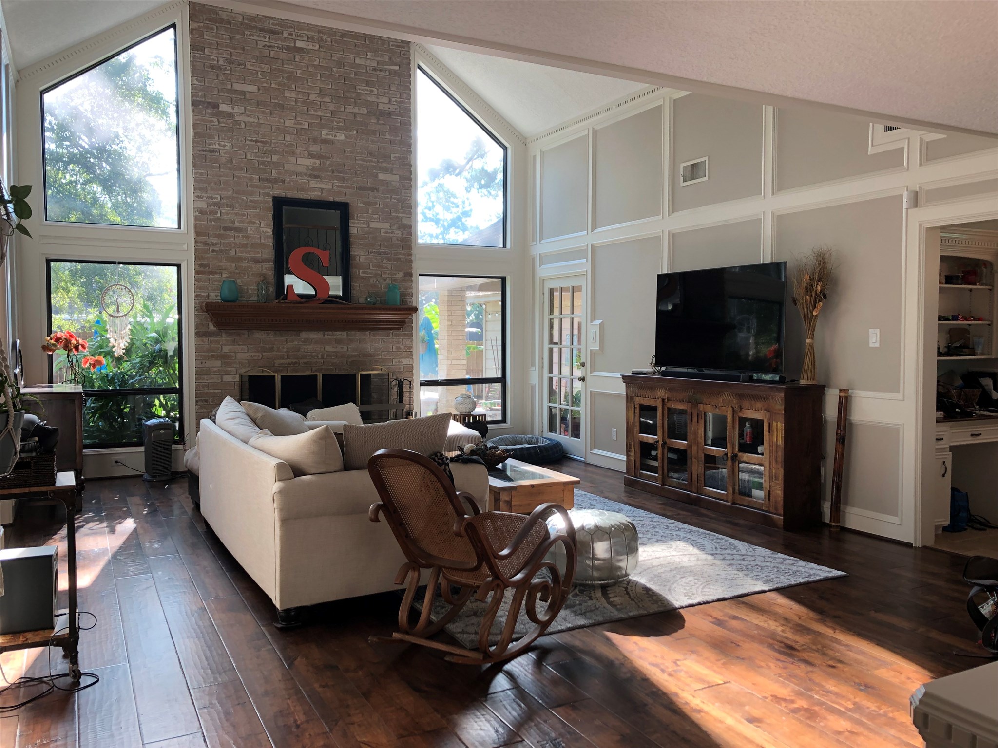 28 Tangle Brush Drive Spring, TX 77381 - Photo 8 of 29 a living room with furniture a flat screen tv and a fireplace