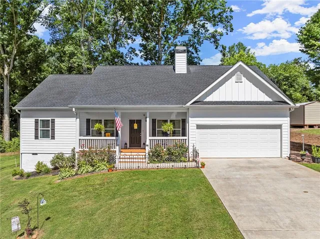 a front view of a house with garden