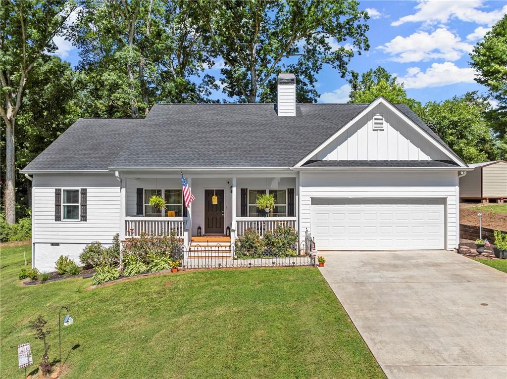 a front view of a house with garden