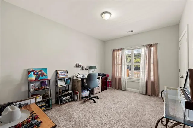 a bedroom with furniture and a window