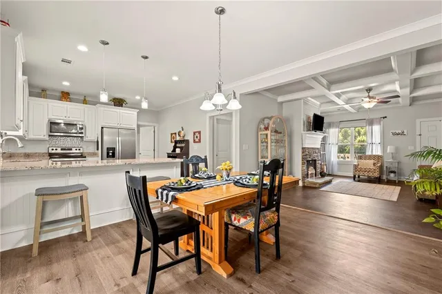 a dining room with furniture a livingroom and chandelier