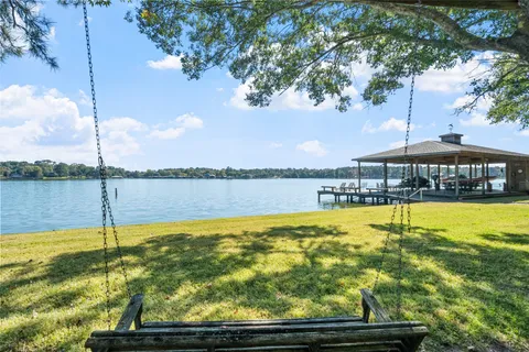 a view of a swimming pool with an outdoor seating
