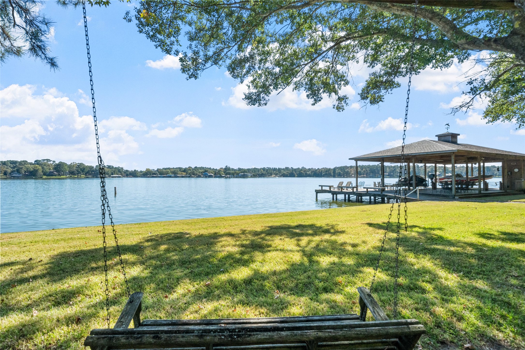 a view of a swimming pool with an outdoor seating