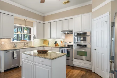 a bathroom with a double vanity sink mirror and double
