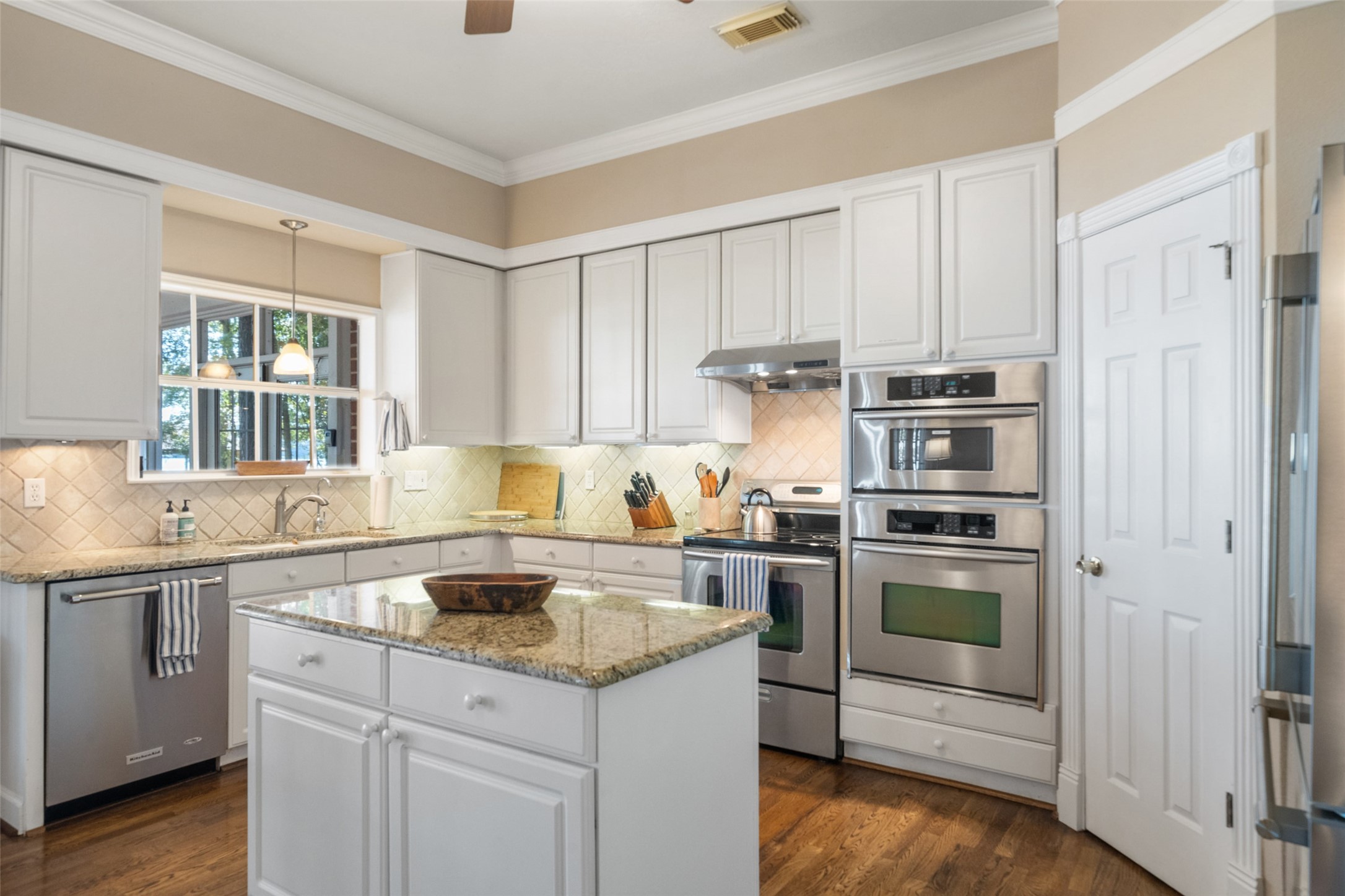 15144 Paradise View Drive Willis, TX 77318 - Photo 15 of 44 a kitchen with a sink stove and cabinets