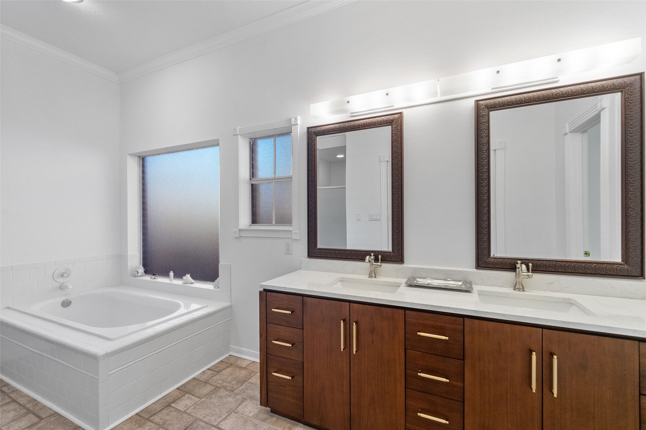 15144 Paradise View Drive Willis, TX 77318 - Photo 19 of 44 a bathroom with a double vanity sink mirror and double