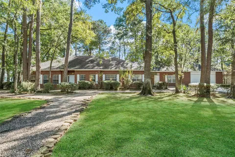 a view of house with a garden space