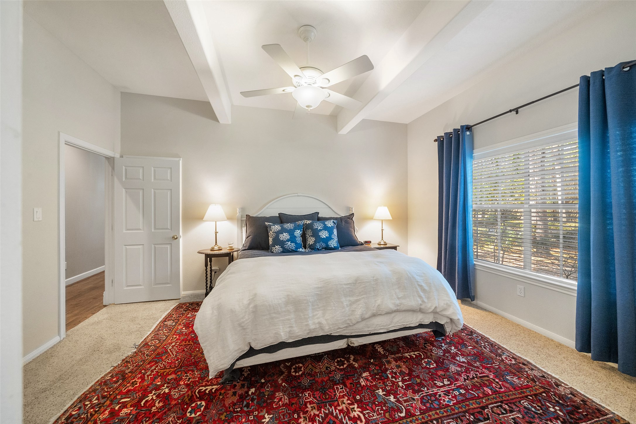 15144 Paradise View Drive Willis, TX 77318 - Photo 22 of 44 a bedroom with a large bed and a chandelier