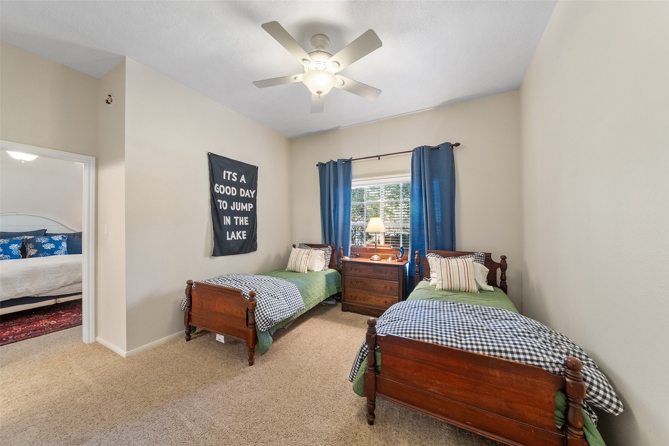 15144 Paradise View Drive Willis, TX 77318 - Photo 24 of 44 a bedroom with bed and window