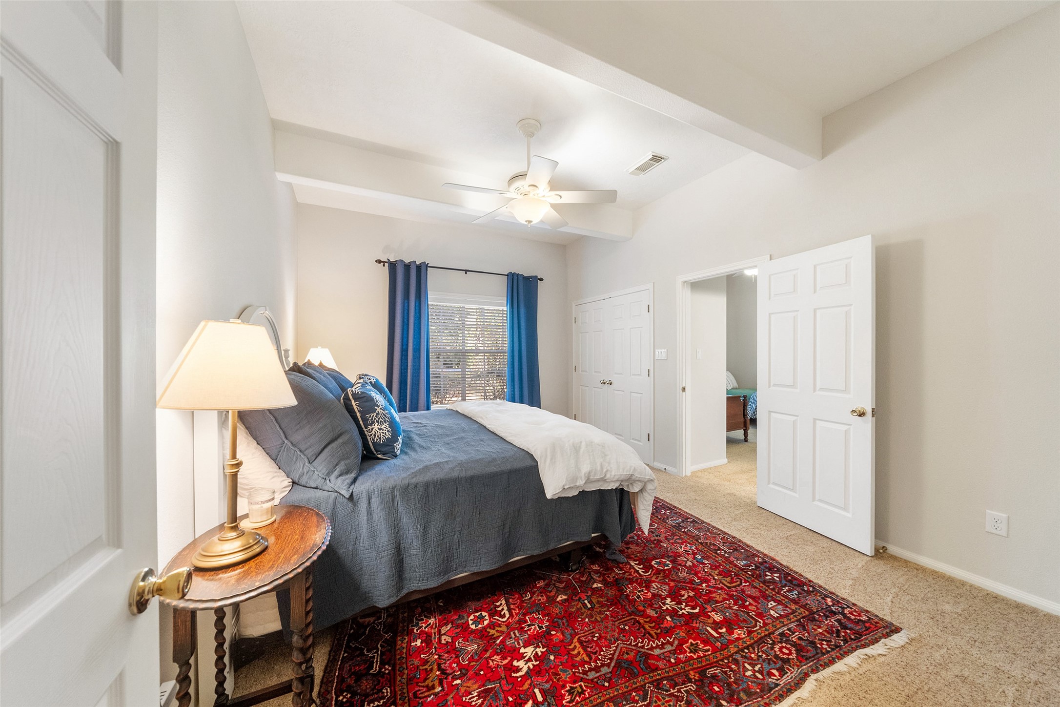 15144 Paradise View Drive Willis, TX 77318 - Photo 25 of 44 a bedroom with bed and a table with rug