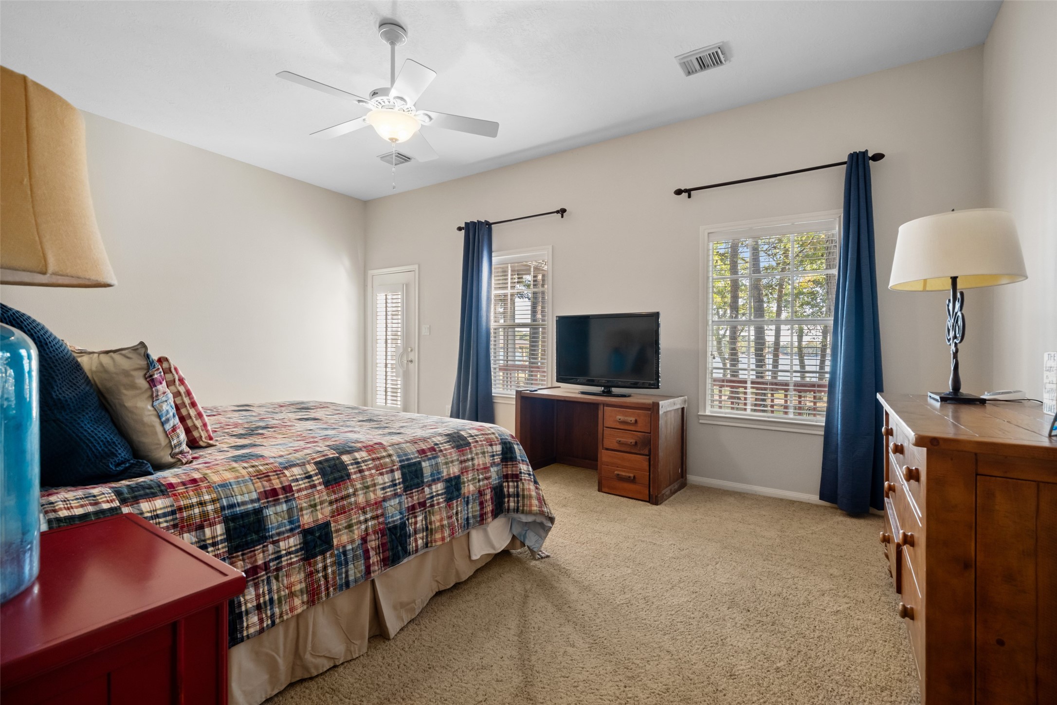 15144 Paradise View Drive Willis, TX 77318 - Photo 26 of 44 a bedroom with a bed and a flat screen tv