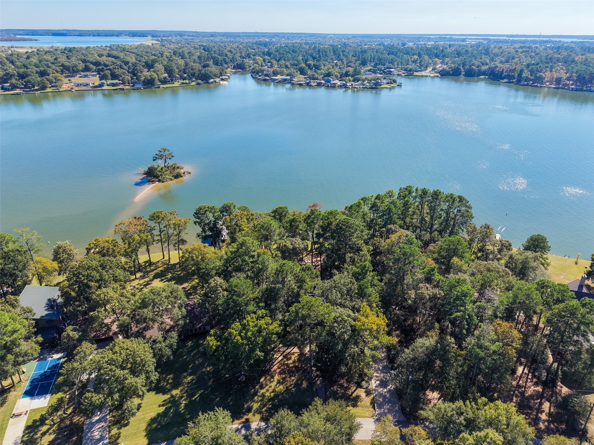 15144 Paradise View Drive Willis, TX 77318 - Photo 38 of 44 an aerial view of a houses with a lake view