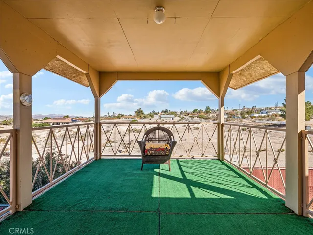 a view of a ocean from a balcony with outdoor space