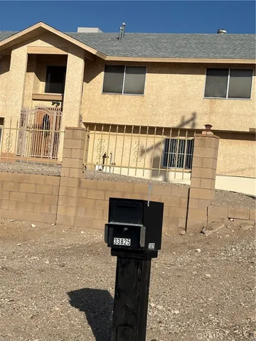 a front view of a house with parking space