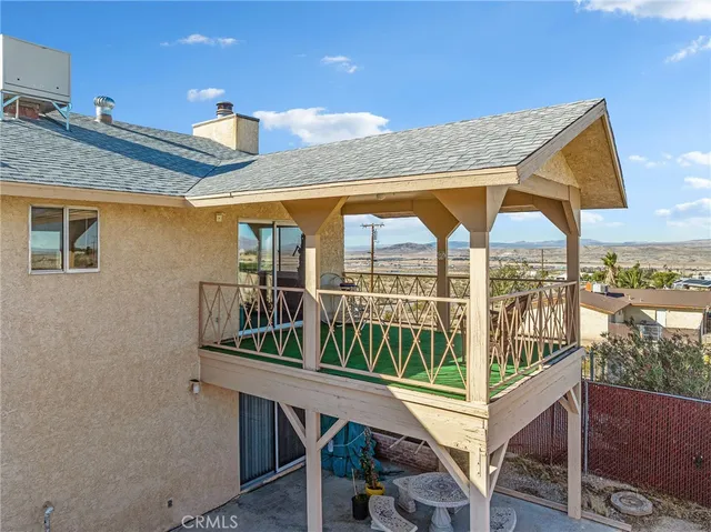 a view of balcony with wooden floor