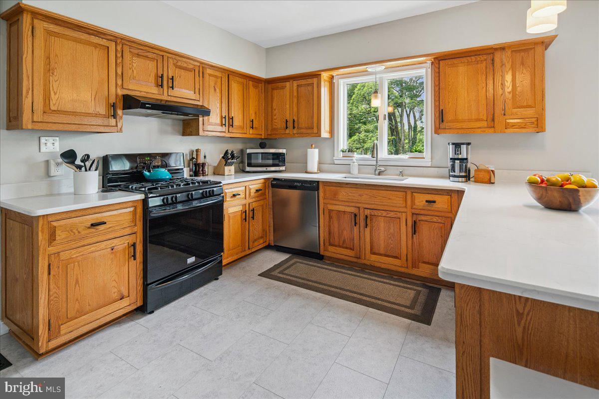 8 High Acres Drive Ewing, NJ 08628 - Photo 12 of 43 a kitchen with stainless steel appliances granite countertop a stove a sink dishwasher and a refrigerator