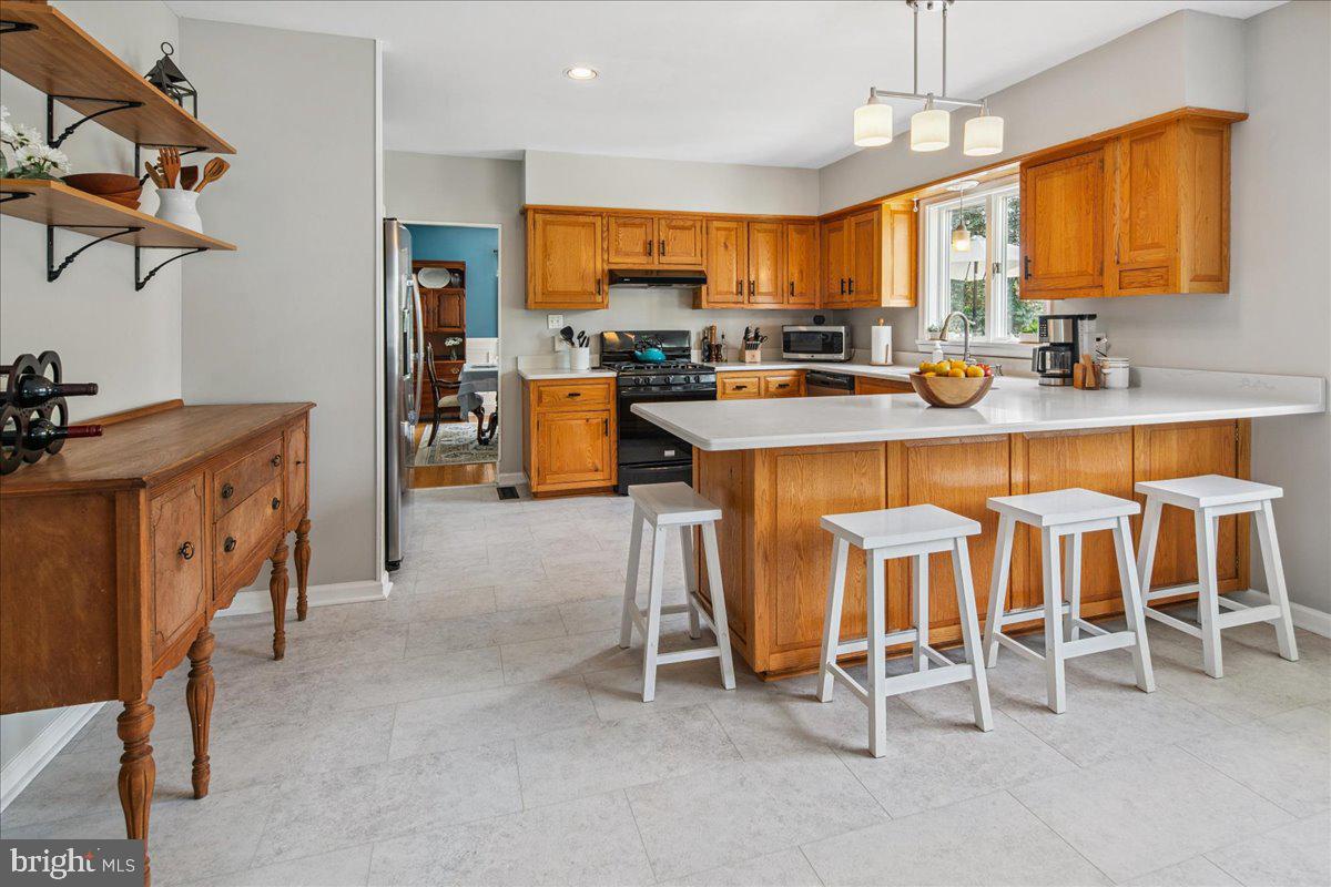 8 High Acres Drive Ewing, NJ 08628 - Photo 14 of 43 a large kitchen with a table and chairs