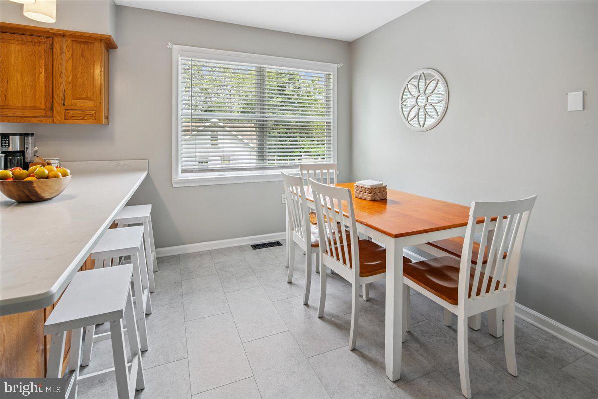 8 High Acres Drive Ewing, NJ 08628 - Photo 15 of 43 a dining room with furniture and a window