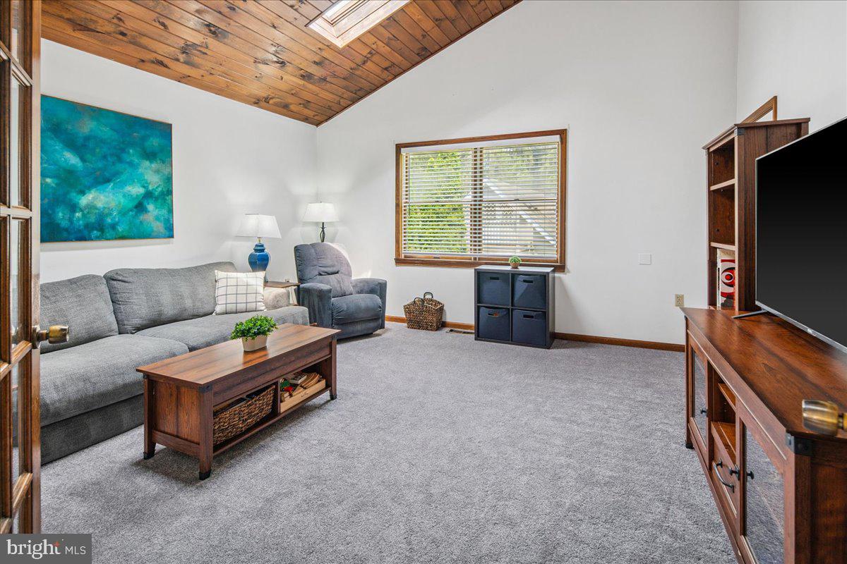 8 High Acres Drive Ewing, NJ 08628 - Photo 17 of 43 a living room with furniture and a flat screen tv