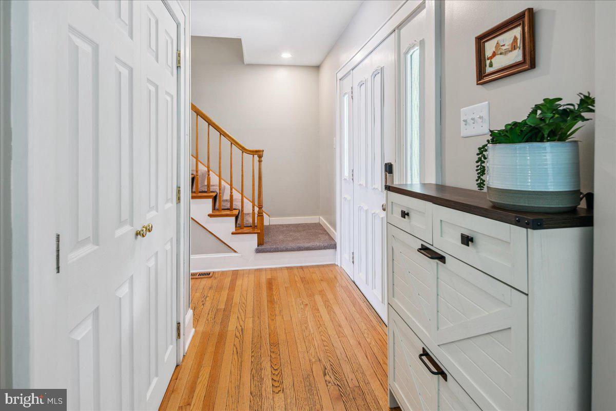 8 High Acres Drive Ewing, NJ 08628 - Photo 2 of 43 a view of a hallway with wooden floor and staircase