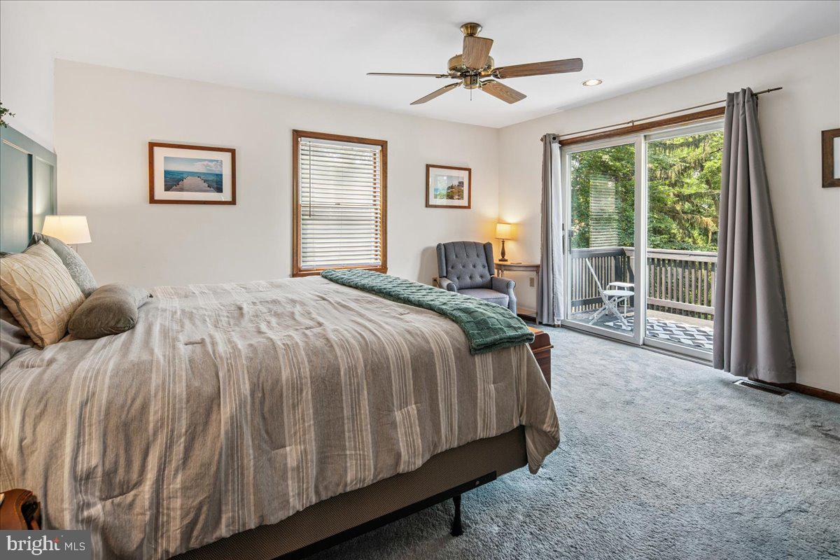 8 High Acres Drive Ewing, NJ 08628 - Photo 22 of 43 a spacious bedroom with a large bed and a tv