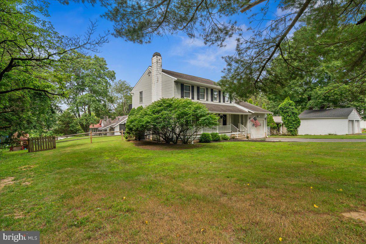 8 High Acres Drive Ewing, NJ 08628 - Photo 33 of 43 a front view of a house with a garden