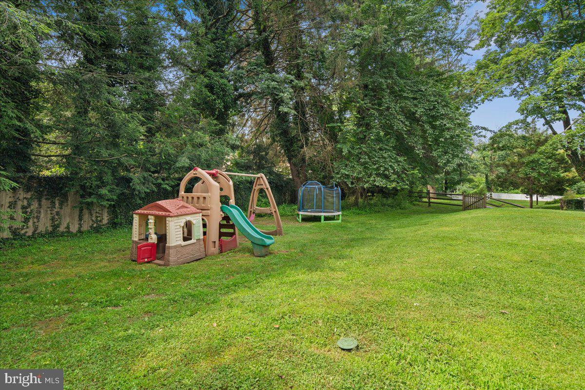8 High Acres Drive Ewing, NJ 08628 - Photo 38 of 43 a view of a house with a backyard and a slide