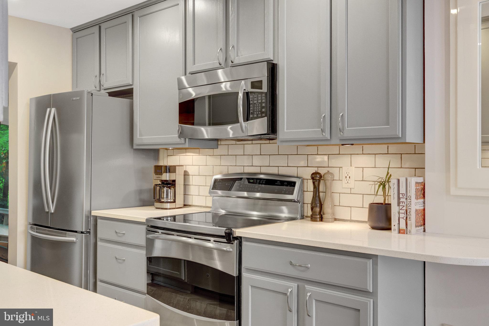 11712 Indian Ridge Road Reston, VA 20191 - Photo 18 of 77 a kitchen with appliances a sink and cabinets