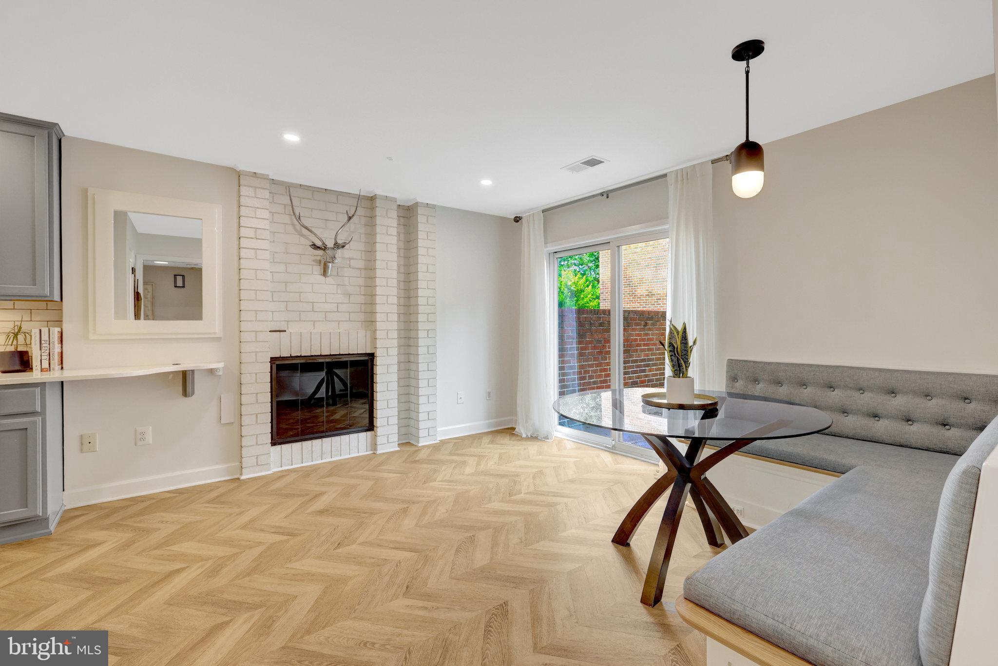 11712 Indian Ridge Road Reston, VA 20191 - Photo 23 of 77 a view of empty room with furniture and kitchen view
