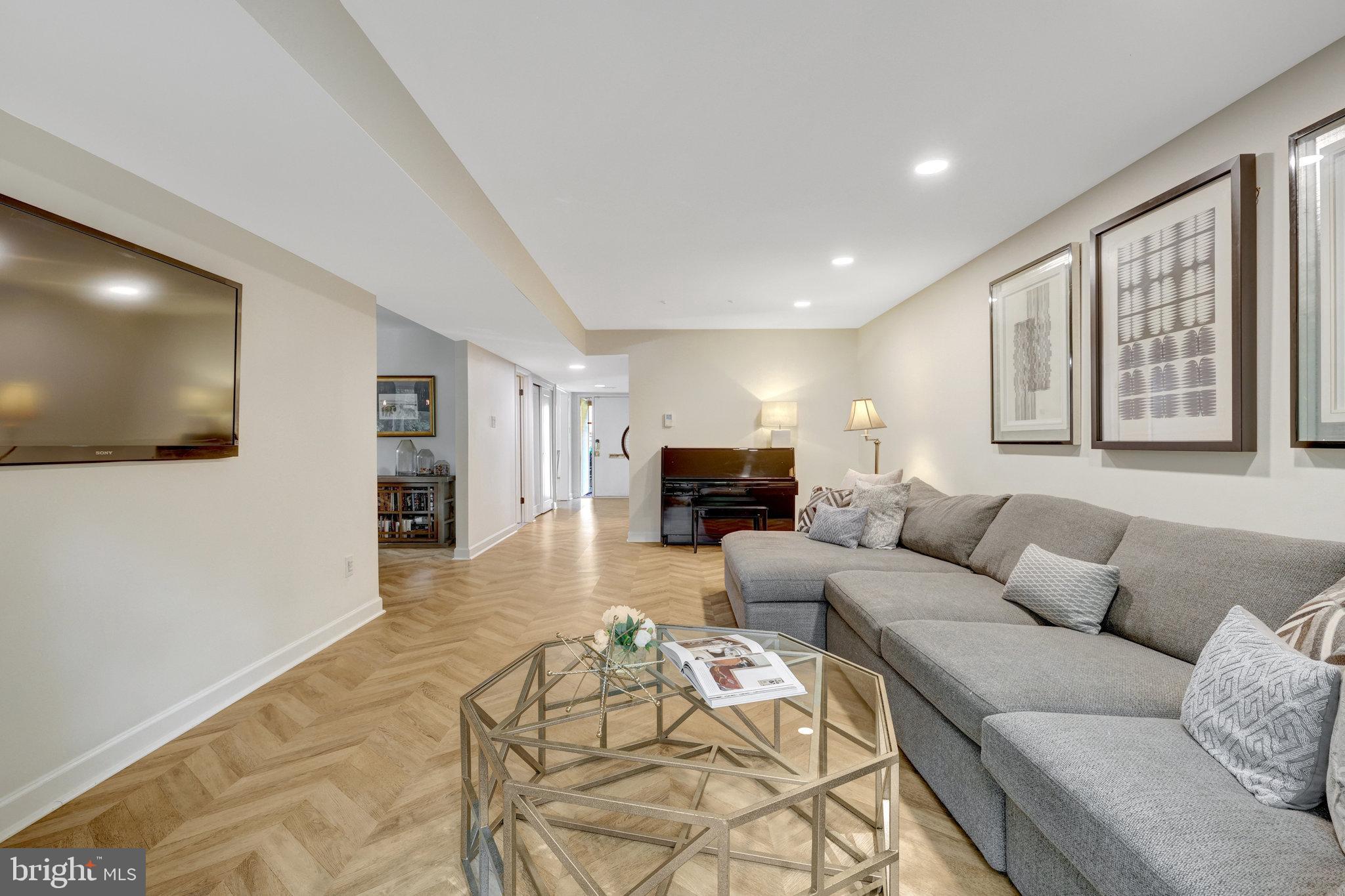 11712 Indian Ridge Road Reston, VA 20191 - Photo 34 of 77 a living room with furniture and a flat screen tv