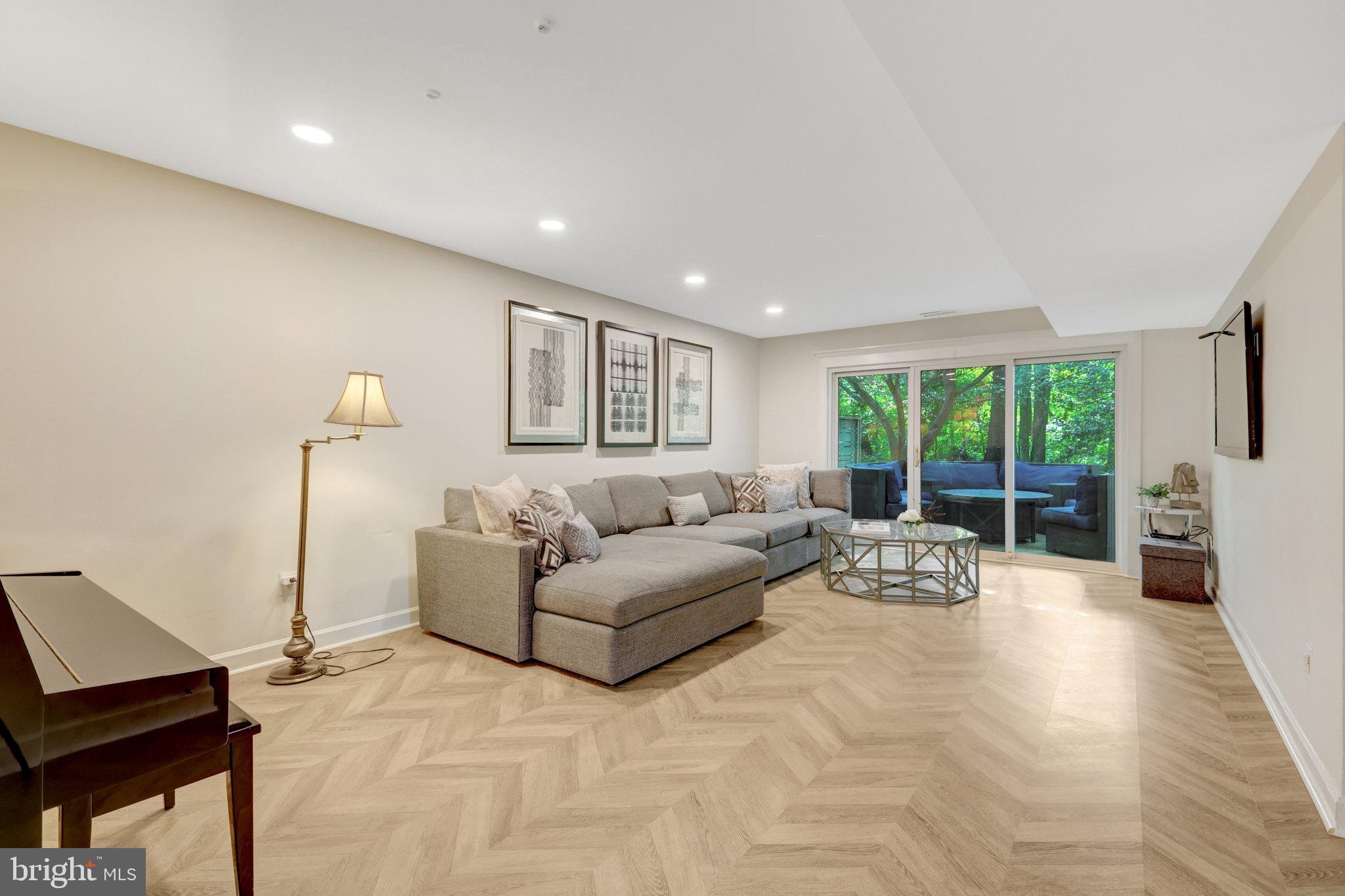 11712 Indian Ridge Road Reston, VA 20191 - Photo 35 of 77 a living room with furniture and a large window