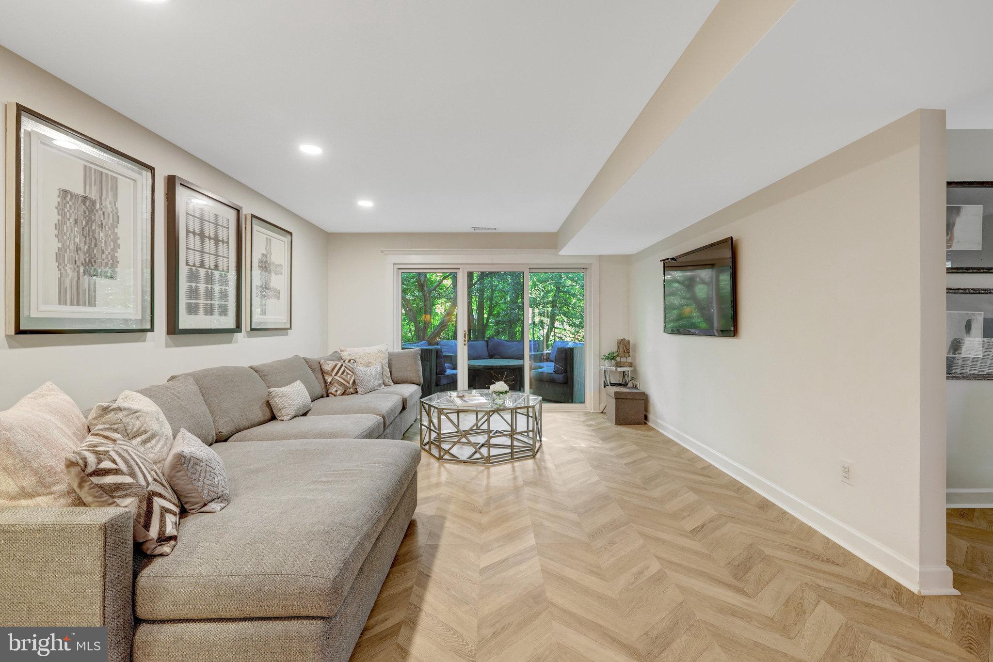11712 Indian Ridge Road Reston, VA 20191 - Photo 36 of 77 a living room with furniture and large windows